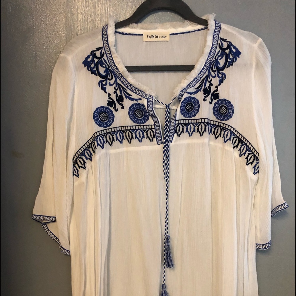 White blouse navy embroidery.